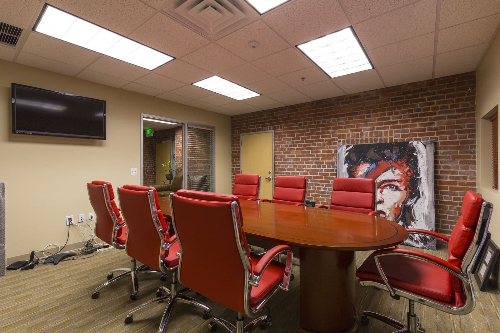 Conference room with exposed brick accent wall