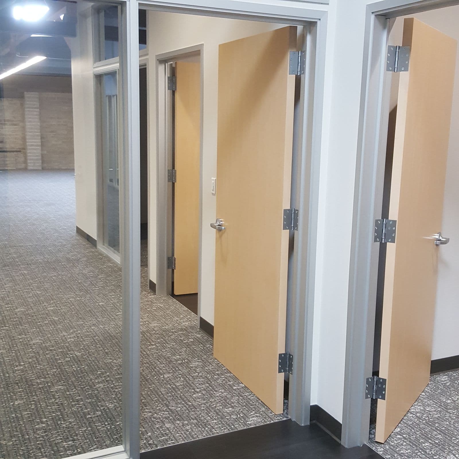 Glass-front private offices during build-out