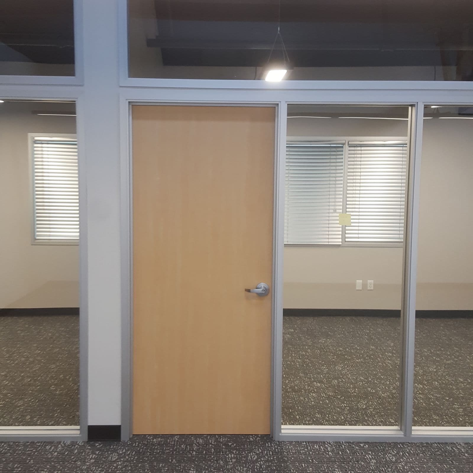 Storefront-style office front with wood door