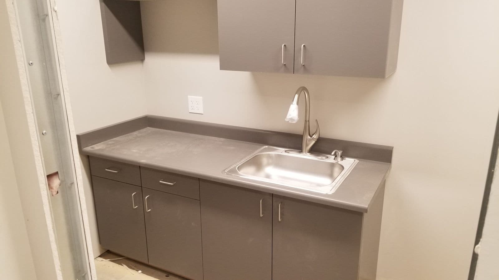 Kitchenette sink and casework in a healthcare office suite