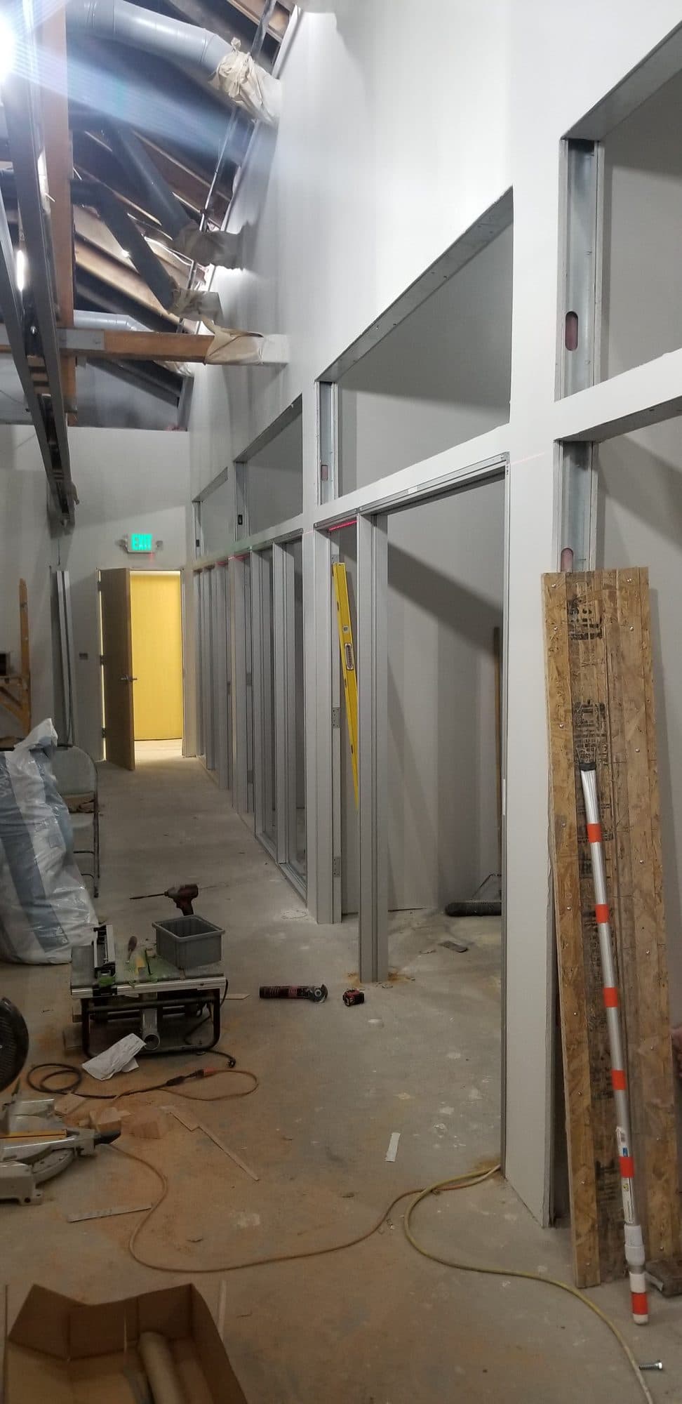 Drywall hung and office fronts framed for glass sidelites down the main corridor