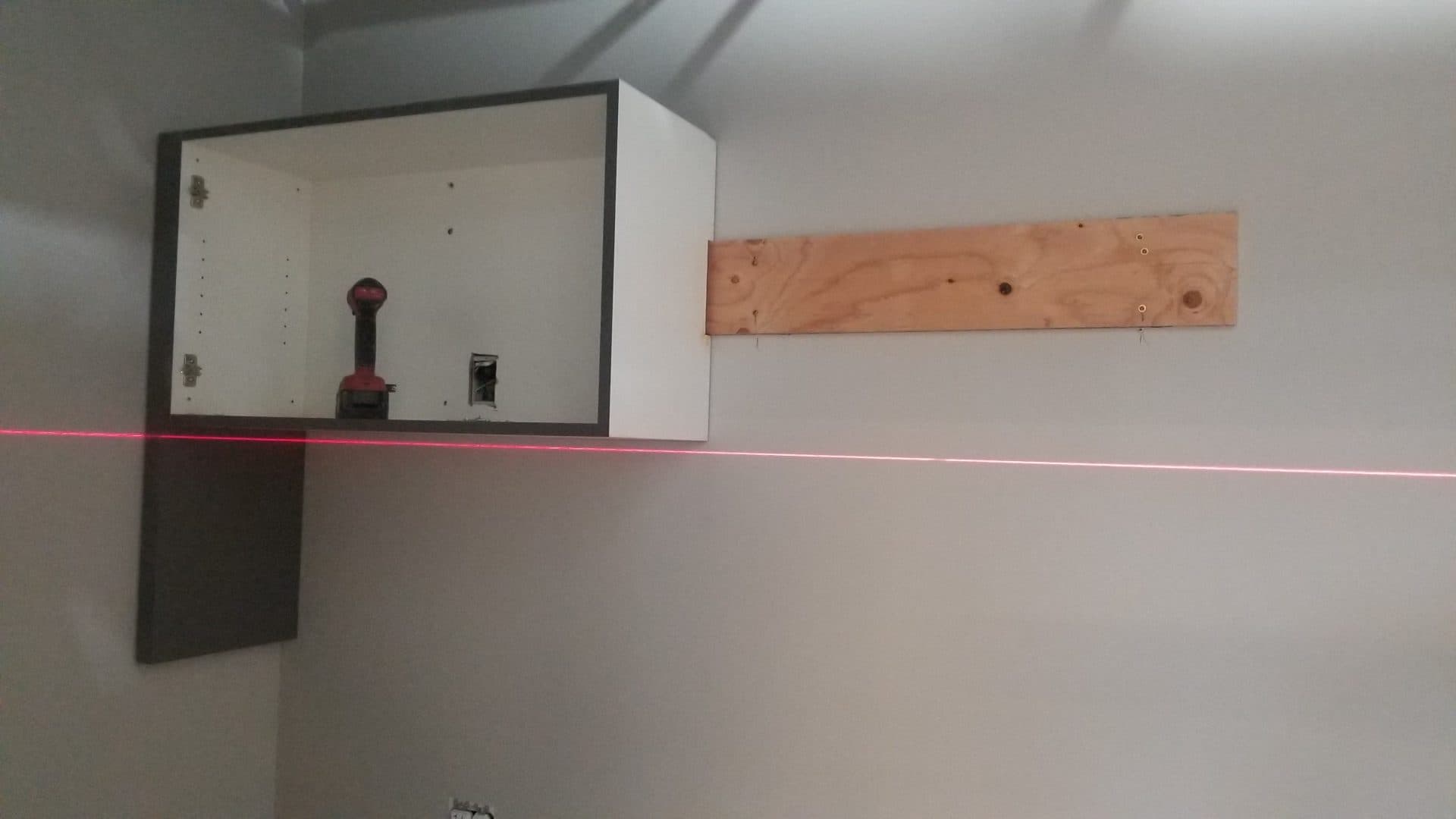 Laser line used to set wall cabinets level