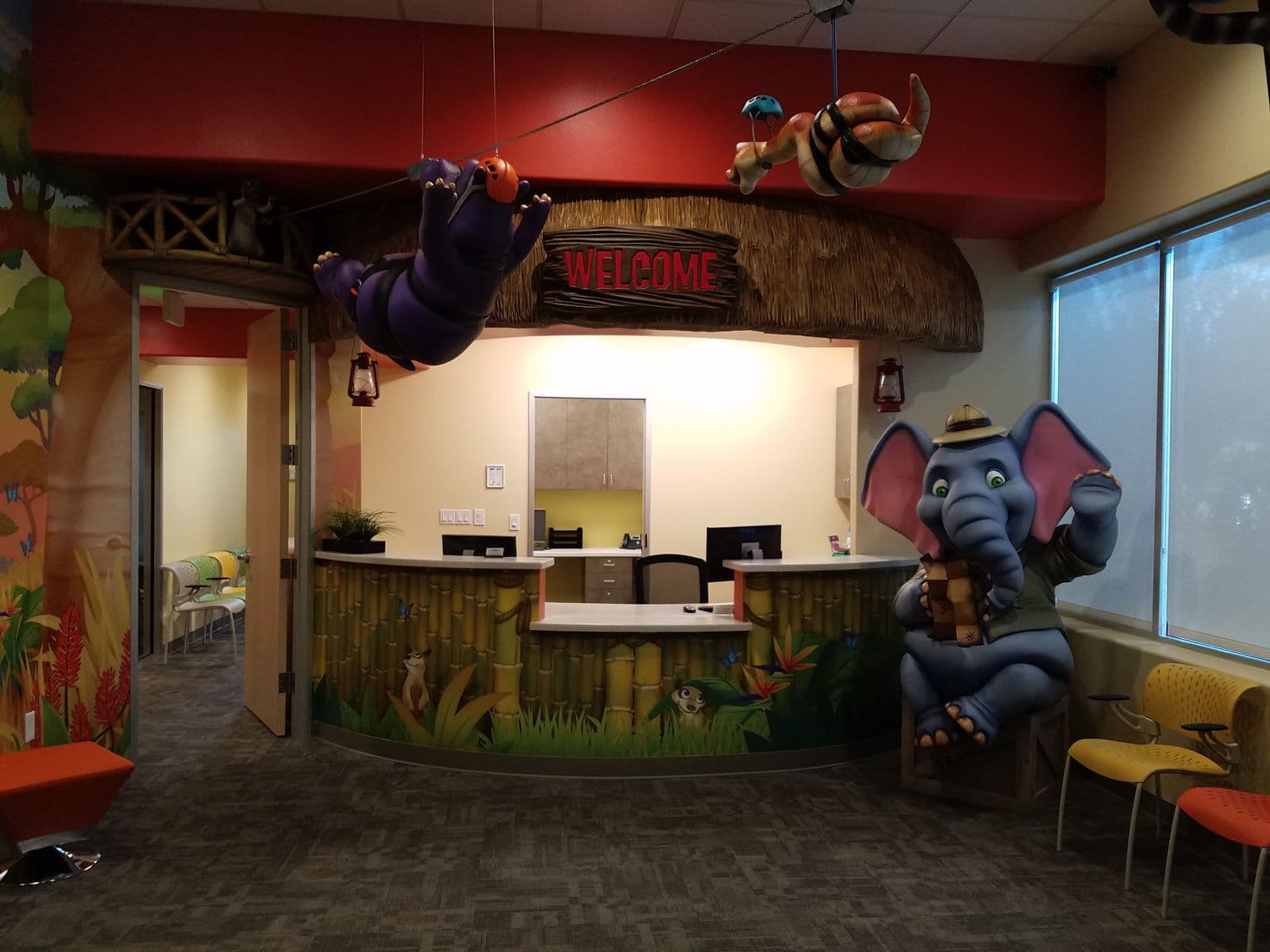 Jungle-themed pediatric dental reception and front desk